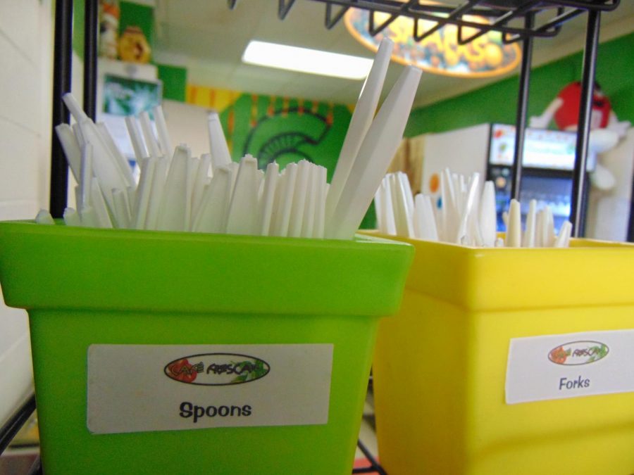 Baskets of plastic silverware are filled and set out for students everyday at lunch.