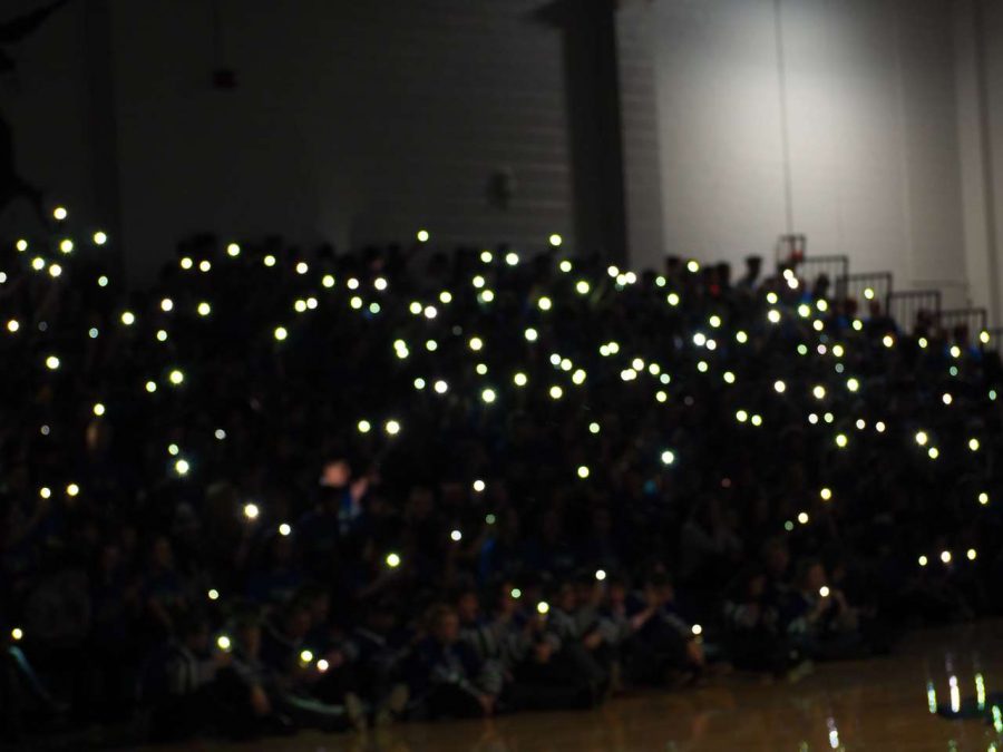 Students+with+their+phone+flashlights+as+the+lights+are+dimmed+for+the+cheer+Rollercoaster.