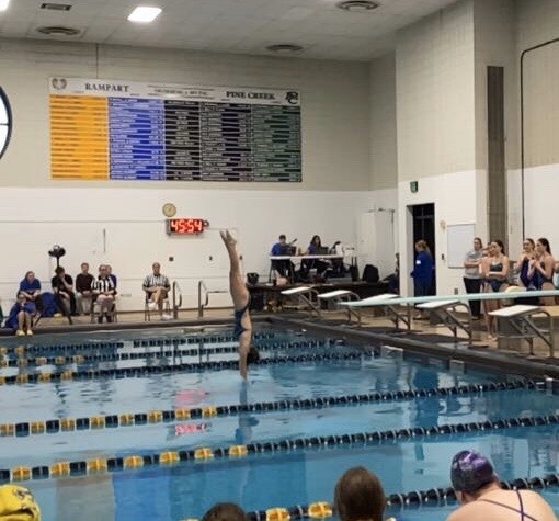 Aurora performing in her meet against Rampart.