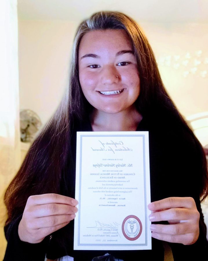 Tafoya poses with her certificate. 