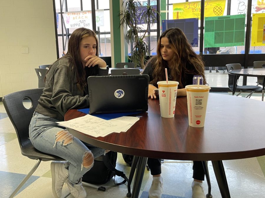 Rebecca and Hessa, in their free period, working on math homework together, right after they went on a trip for some drinks!