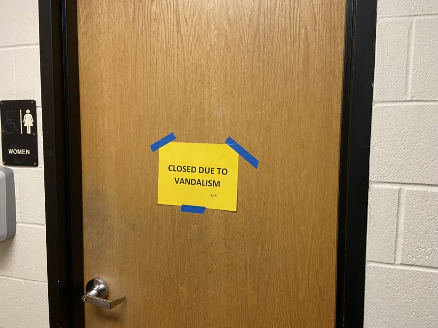 A bathroom sign showing that the girls bathroom is closed.  This has become an epidemic in the school. They need a good wash said Gabriella Pacheco-Diehl