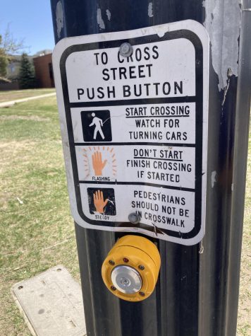 The cross walk button at the stoplight near the student parking lot.