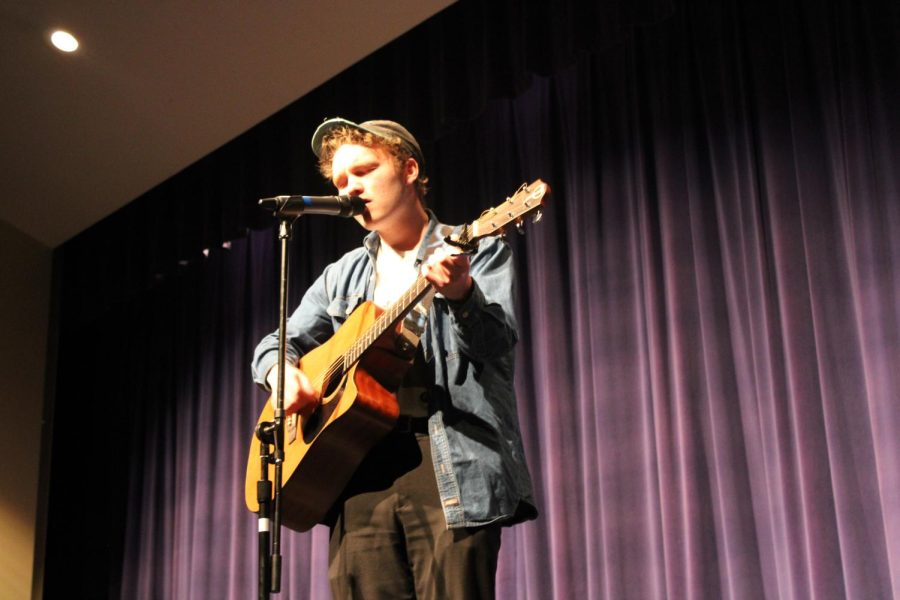 Matt Lynn serenading the audience with a song he wrote during the talent portion. 
