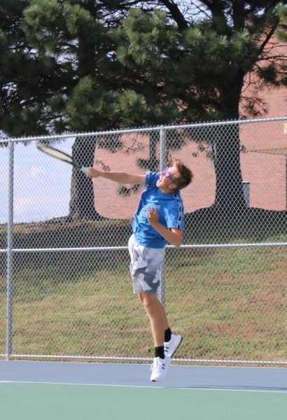 Riley Sack warms up his serve, prepping for his next match on Dohertys home courts.