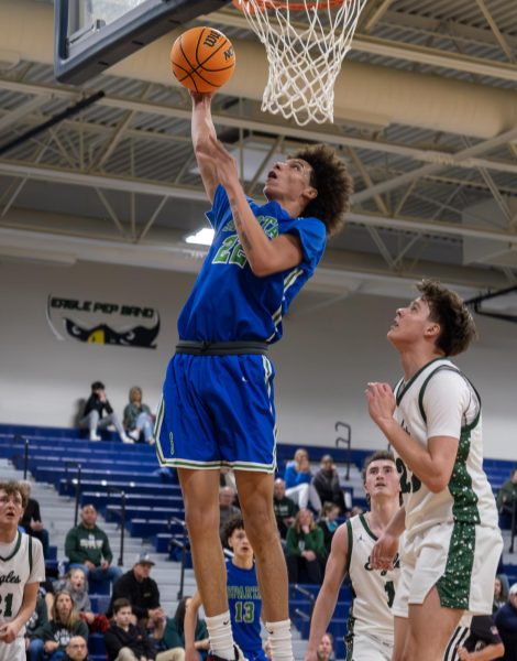 James Pullliam going up for a layup against Pine Creek. 