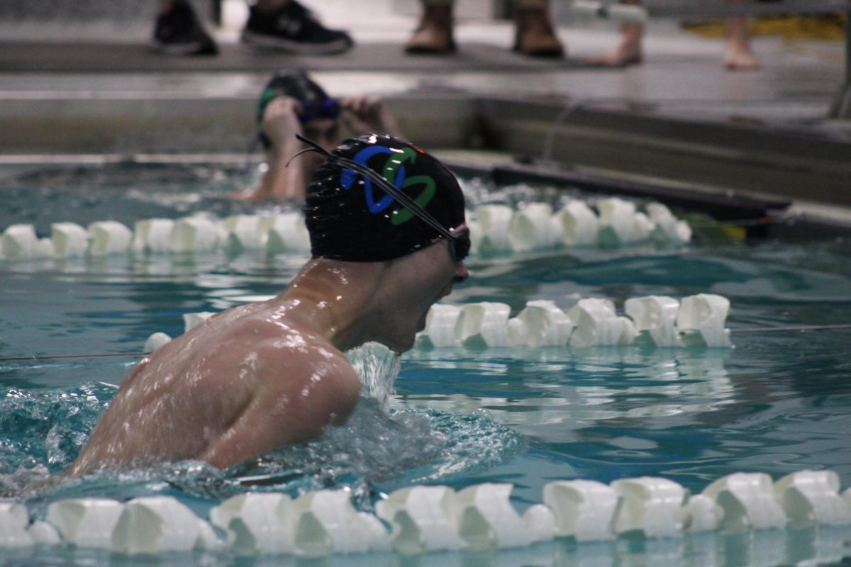 Brendan+Schlak+gasps+for+air+as+he+takes+his+last+stroke+to+the+wall+during+his+100+breast+stroke+at+Doherty+vs+Rampart.