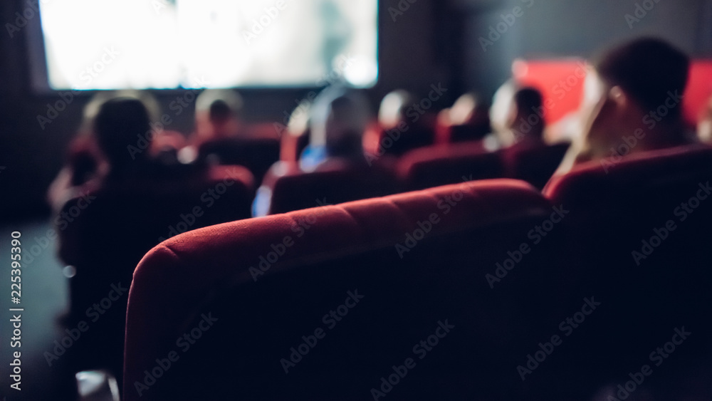 Adobe+Stock+movie+theater+image%2C+people+enjoying+a+new+movie.