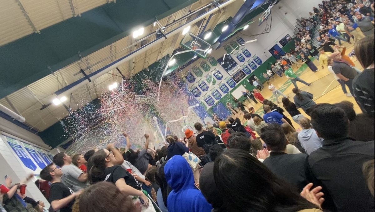 Seniors+celebrating+at+the+final+assembly+with+silly+string+and+streamers.