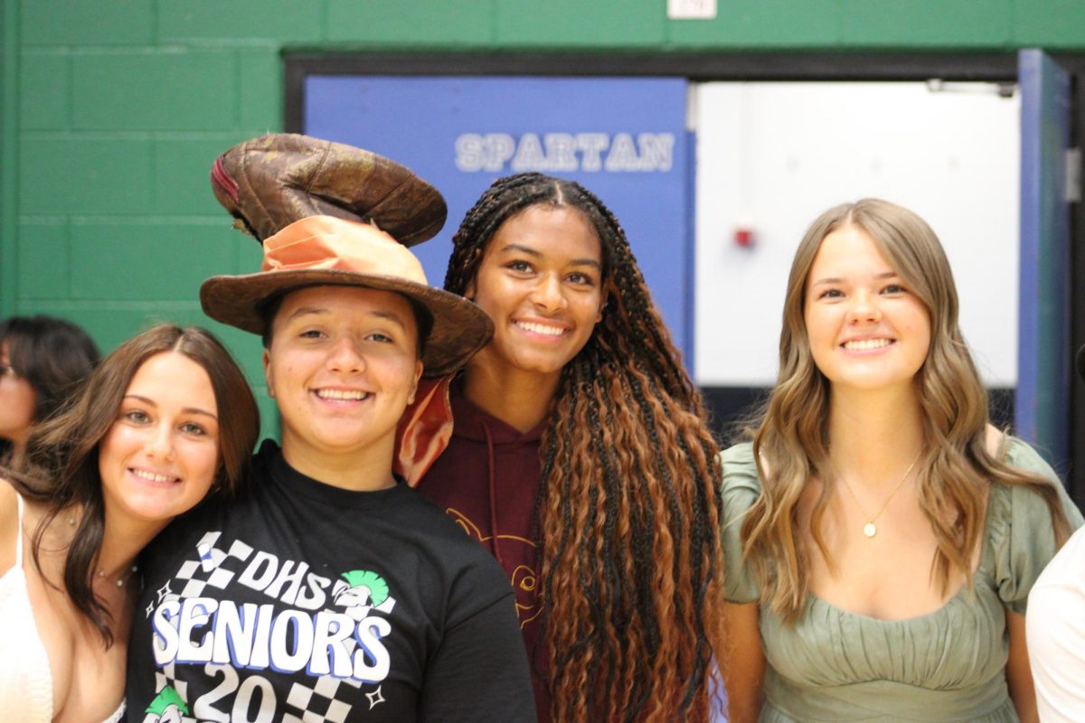 Maizey Gufarotti, Maddie Medlin-Wittenborn, LaLannie Donald, and Zoe Schrader put on skits and work behind the scenes  for the first assembly to welcome the students.