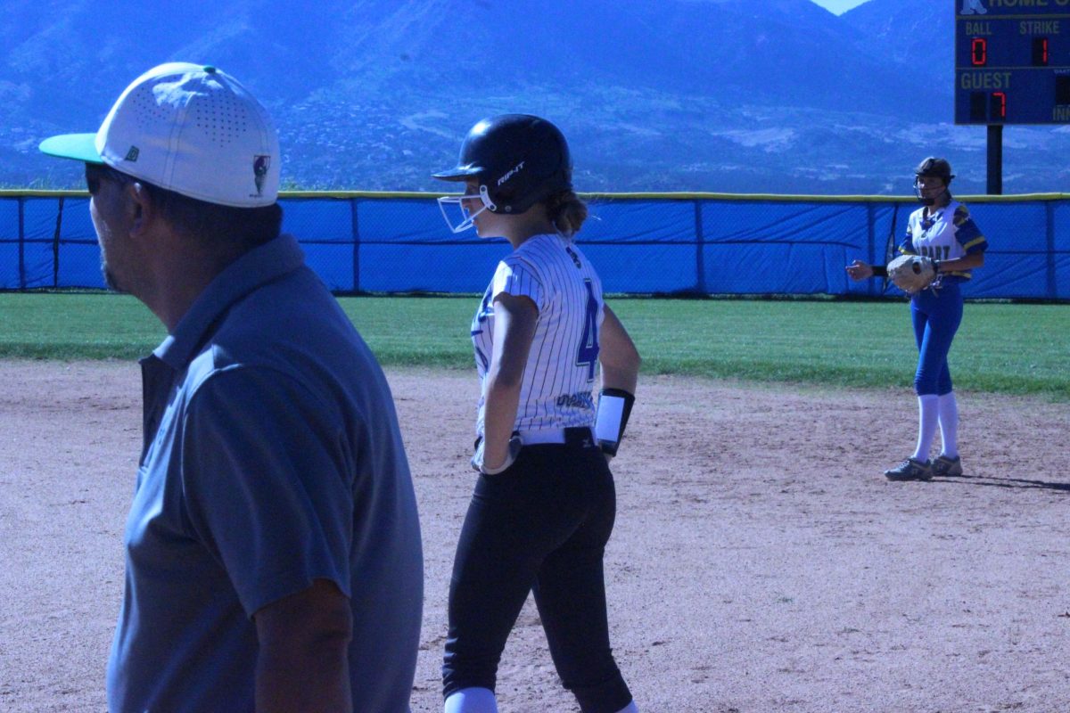 Maddie Schiltz standing getting ready to steal to second base. 