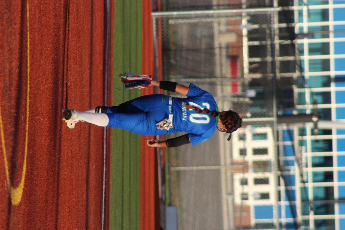 Anahlina Saiz walking back to her position to get ready for the next pitch.