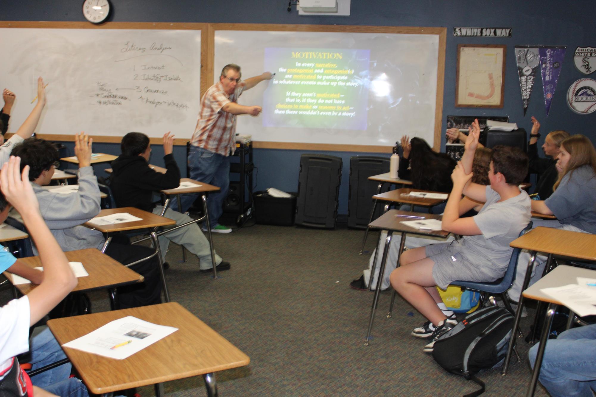 Mr. Anthony Zoubek is teaching his class and they are very engaged. 