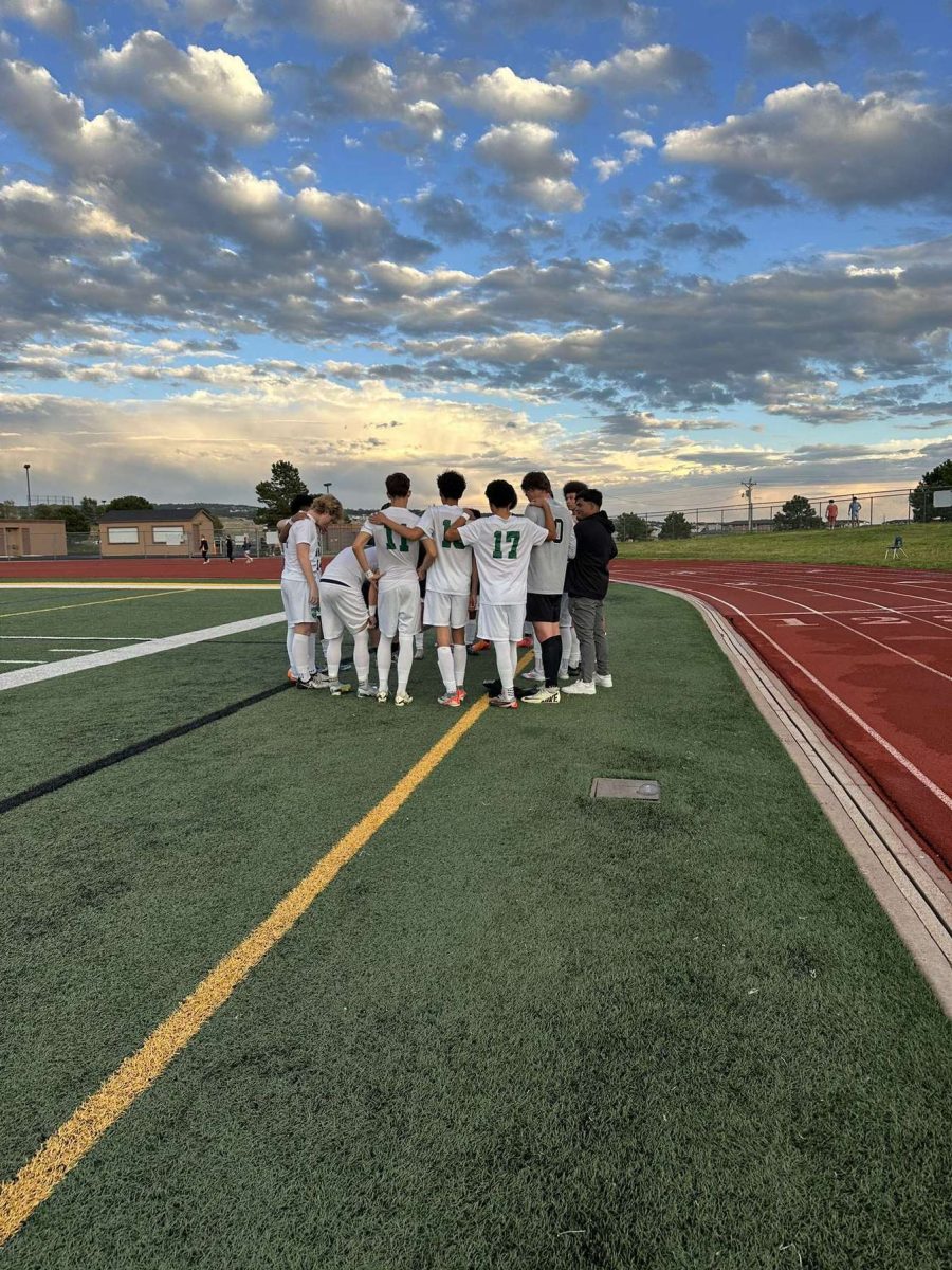 Boys' Soccer in a huddle before their match at Lewis-Palmer 9/4/24.