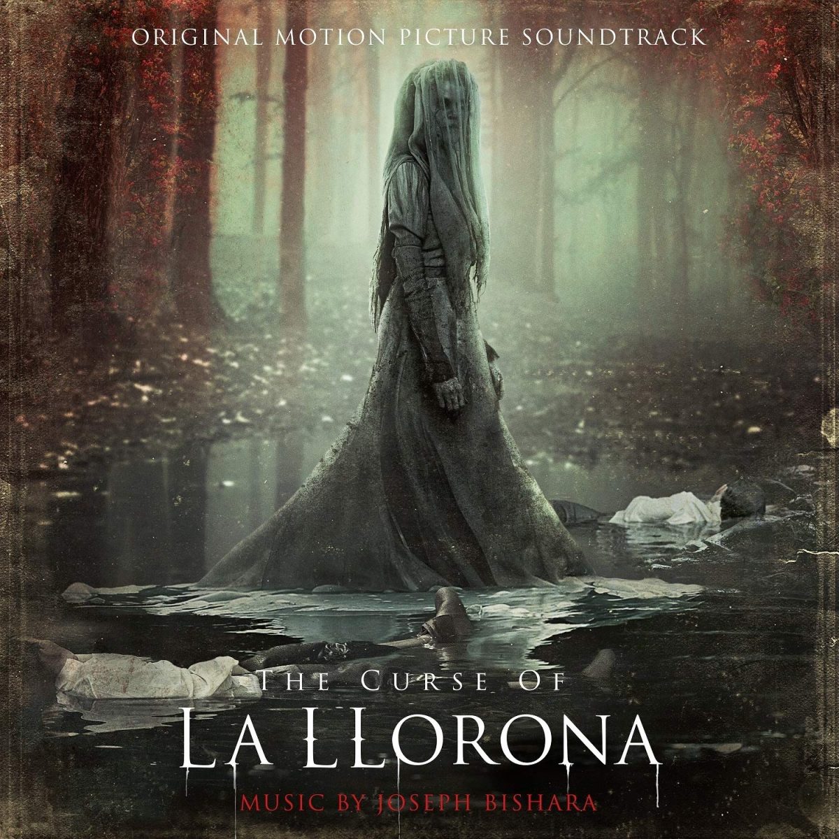 A lady in all white a rising from the creepy dark water in the horror movie La Llorona.