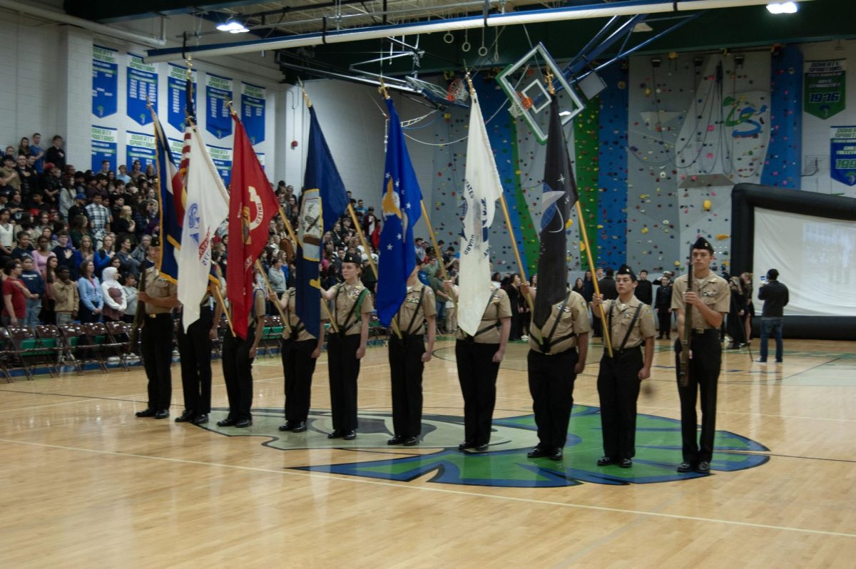 Doherty's nine cadet color guard holding and presenting every flag of our United States military.