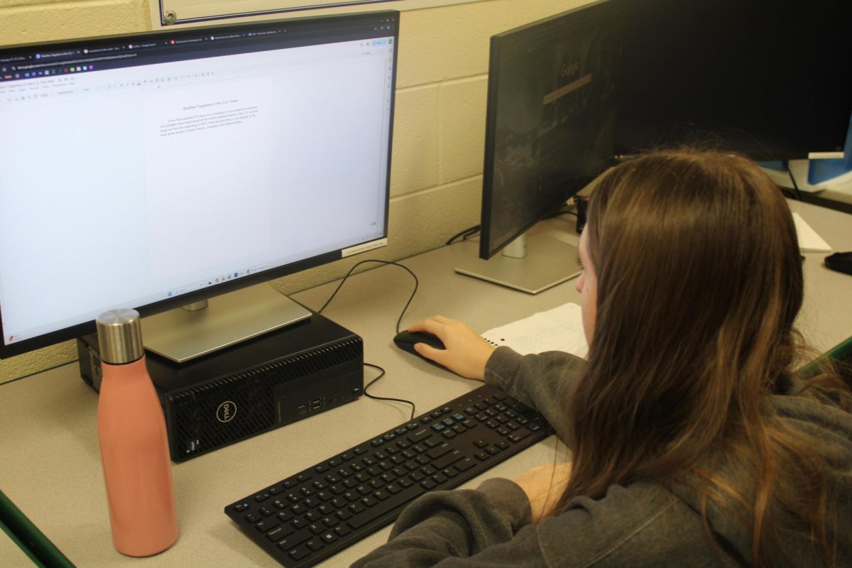 Maddie Menendez student working on her article for January. 