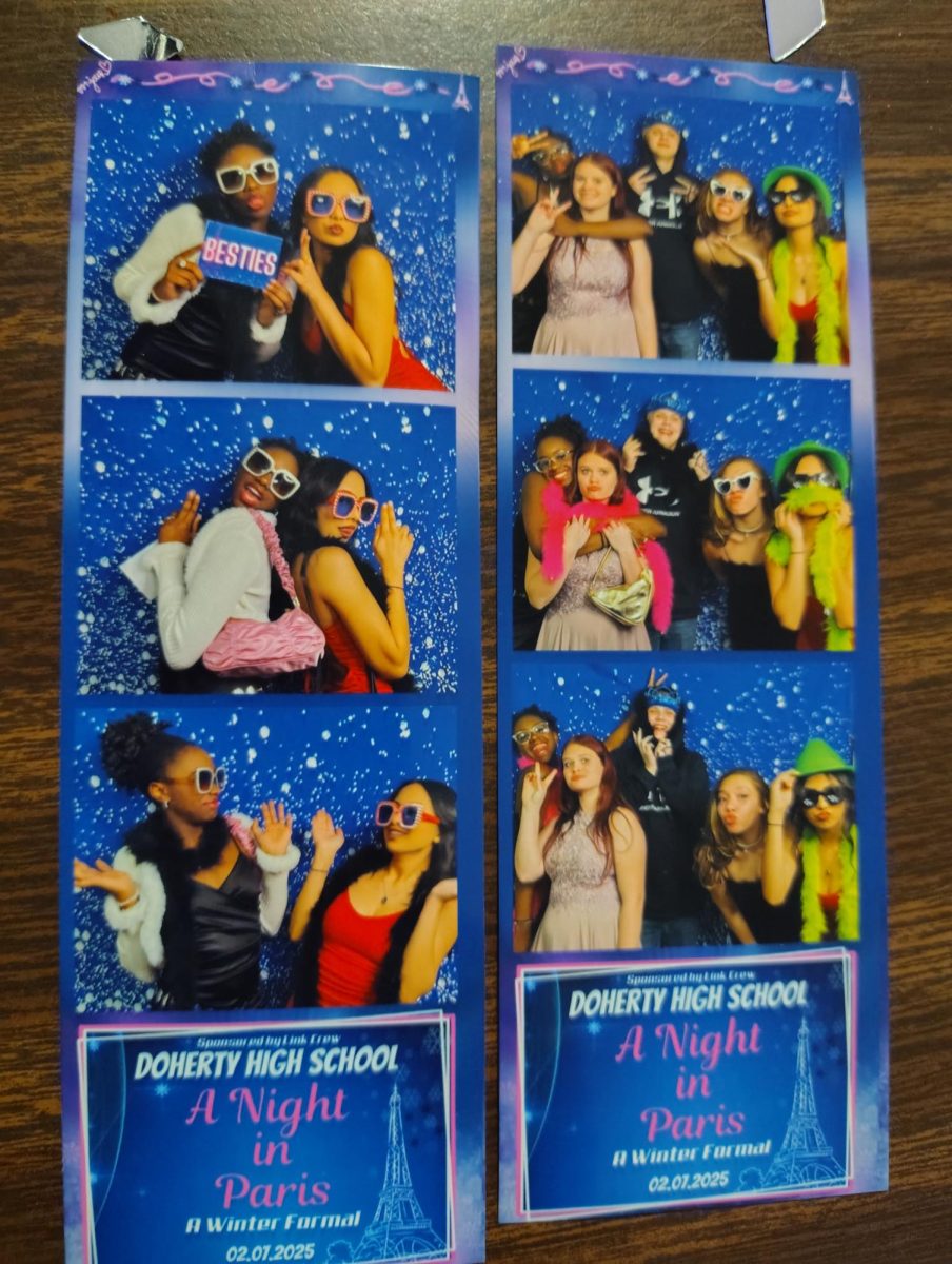 Jaimey Lucero-Ronquillo, Alexandria Brown, Aariana Logan, Caius Carlson at Doherty's Winter Formal enjoying themselves in the photo booth.