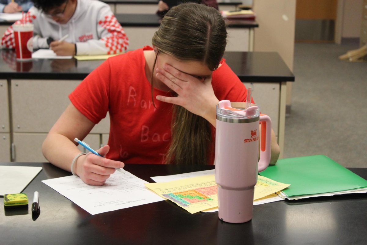 Harlyn Everhart, student athlete falling asleep in class after morning practice.