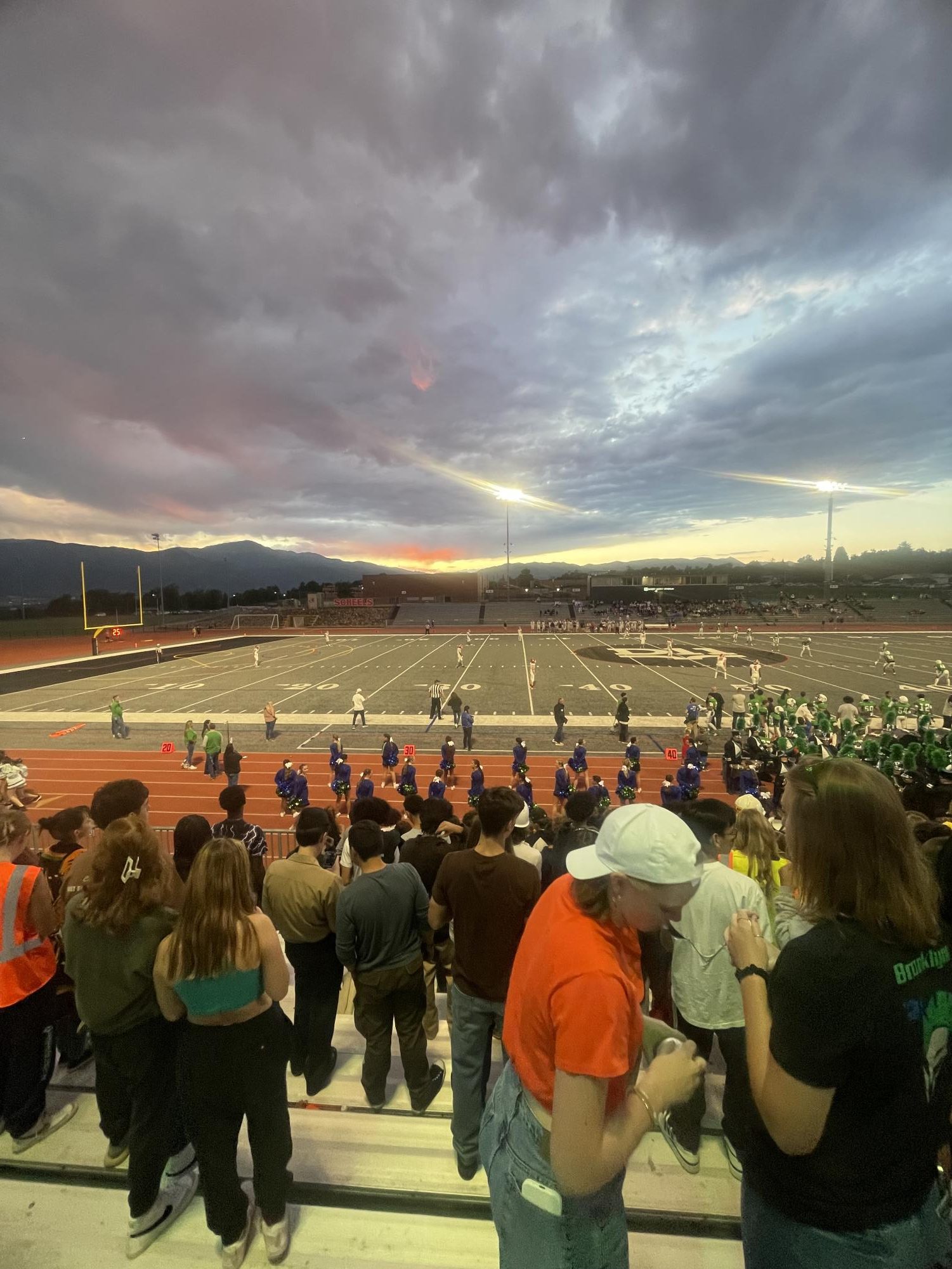 High school students watch a Doherty High School football game.